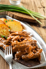 Beef Stroganoff, strips of beef in sour cream served with crisp