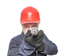 Worker aims drill.