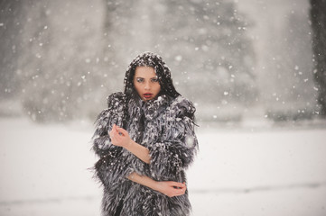 winter portrait of Beauty girl with snow
