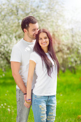 happy young couple in the garden