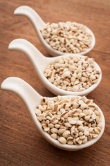 Job's Tears on wooden background