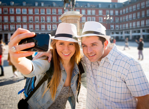 friends tourist couple visiting Europe in holidays taking selfie