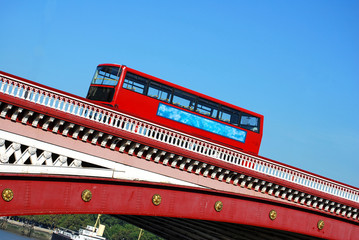 Red double decker bus on Blackfriars bridge in London