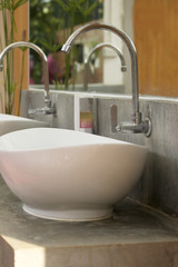 Fototapeta na wymiar Faucetc and white sinks