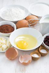 fresh ingredients for baking on a white table, vertical