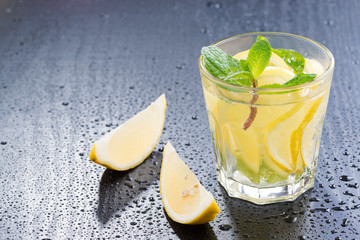 Fresh lemonade with mint on a dark background