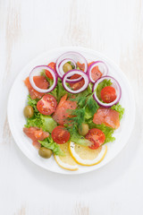 fresh salad with salted salmon, top view, vertical