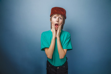 Muslim boy of ten years, skullcap, surprise, his hands on his fa