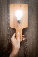 Light bulb on chopping board, serve idea concept