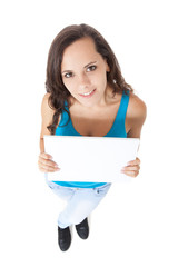 Attractive teenage girl holding blank white sign
