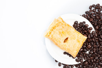 Cup of coffee with Pie on beans.