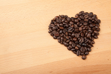 Roasted coffee beans in heart shape