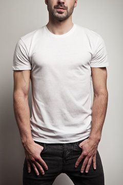White blank t-shirt on young and handsome man, front