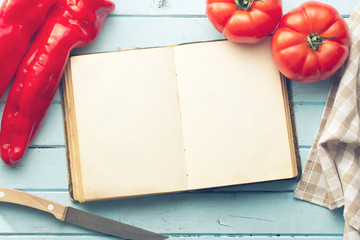 blank cookbook and vegetable