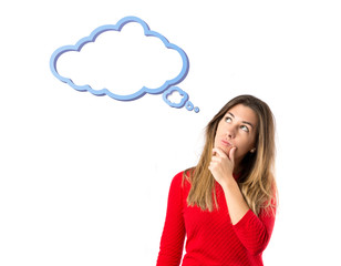 Cute young girl thinking an idea over isolated white background