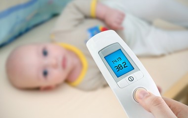 Measuring temperature to a baby with digital thermometer