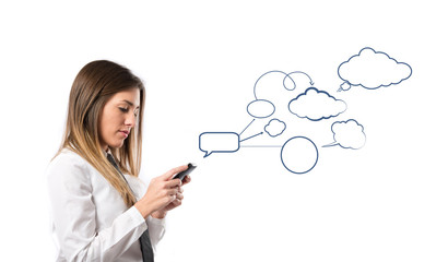 Young businessmen with his mobile over isolated background.