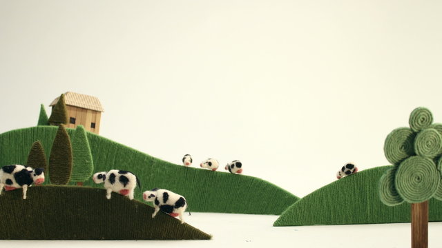 Happy cows grazing on meadow - puppet animation