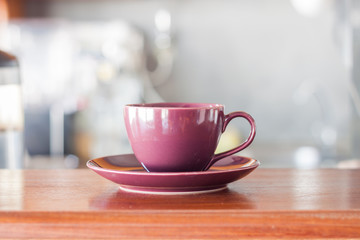 Purple coffee cup in coffee shop