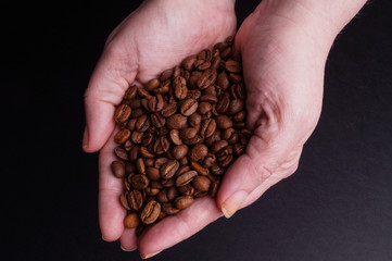 Hands holding Coffee Beans