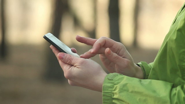 woman using smartphone, chatting, close up