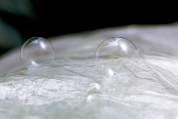 Two large soap bubbles