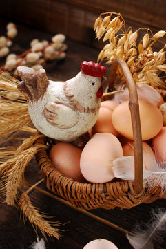 Easter Decoration Of Hen In Wicker Basket With Eggs