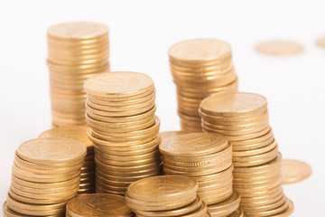 stacks of coins on white backgrond