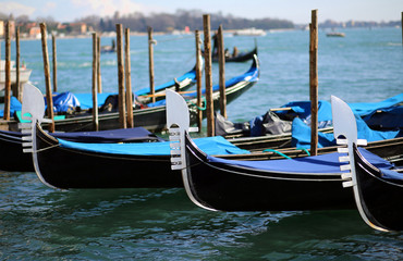 Fototapeta na wymiar three gondolas near St. Mark's square in Venice