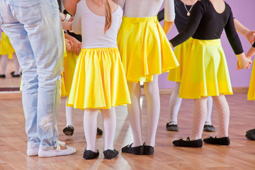 Fototapeta na wymiar Ballet dancers children in class, legs only