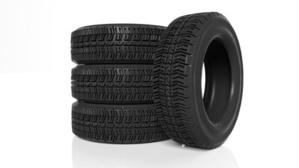 Stack of four black tires isolated on white background