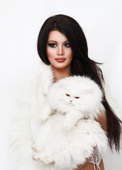 Beautiful woman holding white persian cat