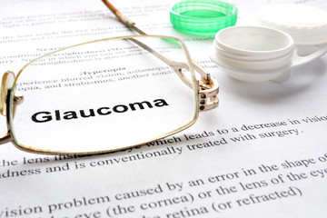 Paper with words  glaucoma, glases and container for lenses.