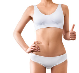 Fototapeta na wymiar Woman with beautiful slim body posing in underwear on the white