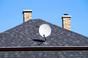 House roof with smoke stacks and antenna