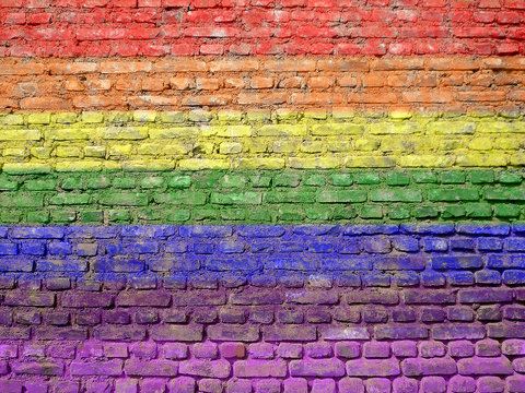 Rainbow-flag painted on old wall