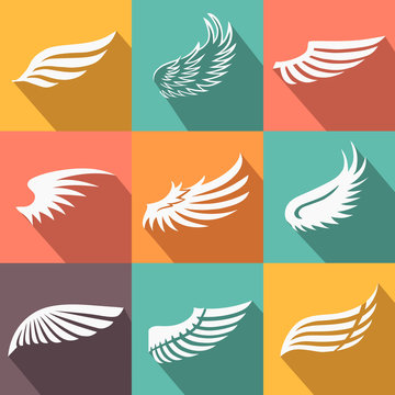 Abstract feather angel or bird wings icons set isolated