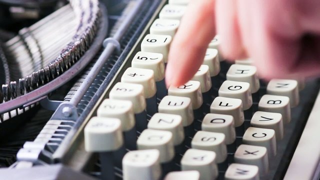 typewriter typing. Vintage typewriter being used by male hands