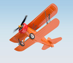 Orange biplane flying in the sky