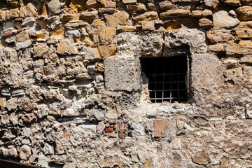 Fototapeta na wymiar old stone wall with window