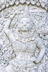 Fototapeta na wymiar White demon guardian at Ming Mueang temple, Nan province, Thaila