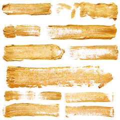 Naklejka premium Strokes of golden paint