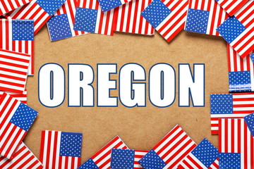 The title Oregon with a border of USA Flags