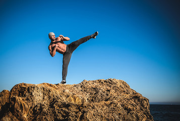 karate training on the shores of the sea