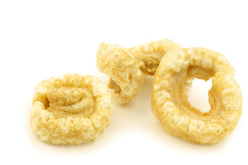 crispy fried bacon snacks on a white background