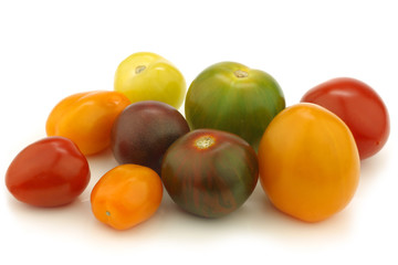  little colorful snack tomatoes on a white background