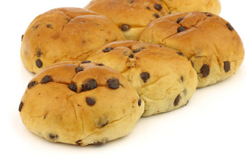 reshly baked traditional dutch buns with chocolate chips on a wh