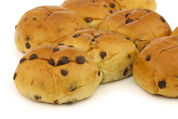 reshly baked traditional dutch buns with chocolate chips on a wh