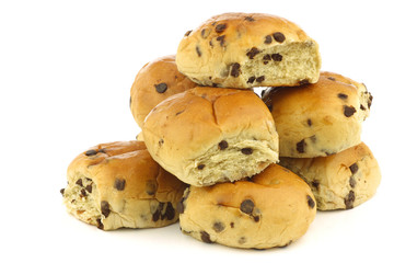 reshly baked traditional dutch buns with chocolate chips on a wh