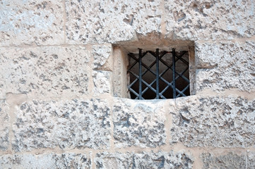 Mysterious opening in medieval wall. Mallorca, Spain.